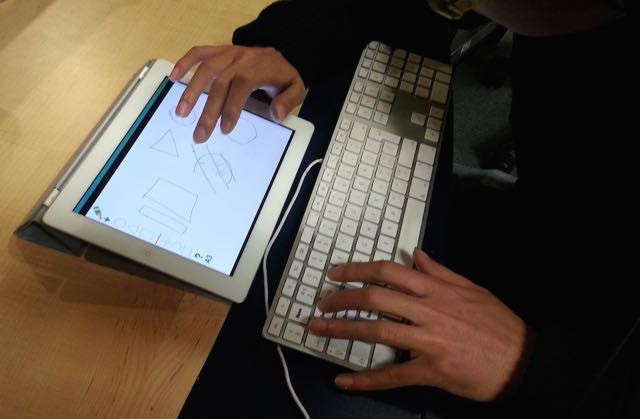 A user interacting with the Drawchestra prototype