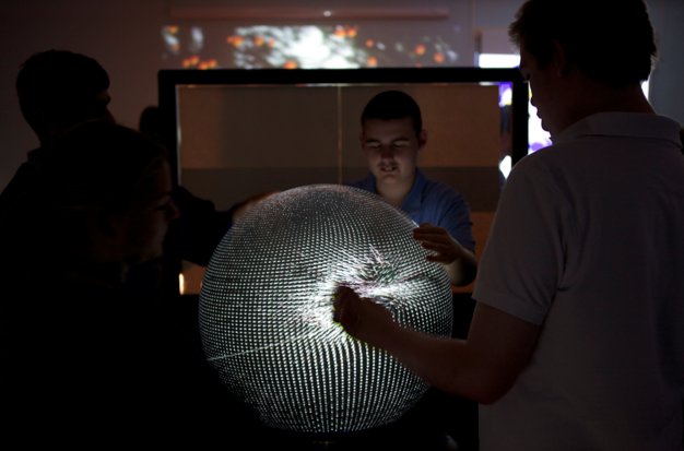 Students interacting with the multi-touch sphere